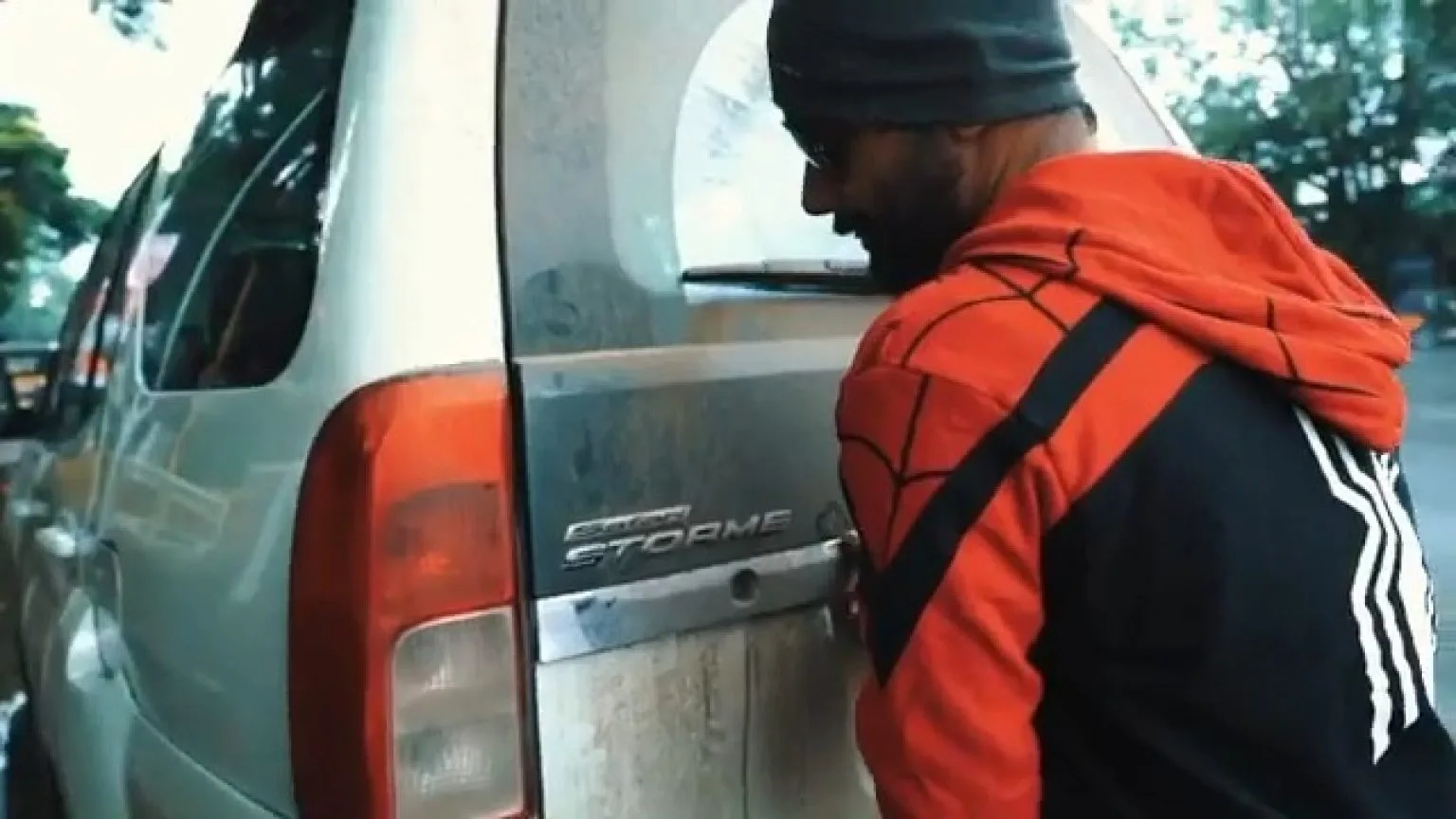 Man in Spider-Man hoodie looking