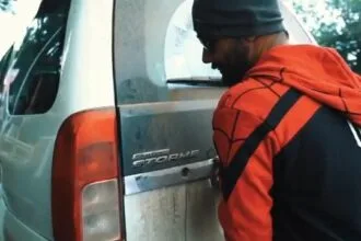 Man in Spider-Man hoodie looking