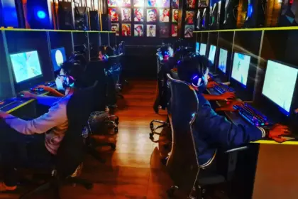 Alpha Esports Gaming Cafe Bangalore large gaming room with rows of players and RGB setups
