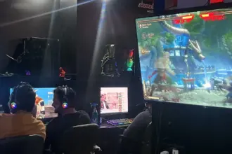 Echo Esports Gaming Cafe Bangalore interior gamers playing Mortal Kombat with RGB headsets