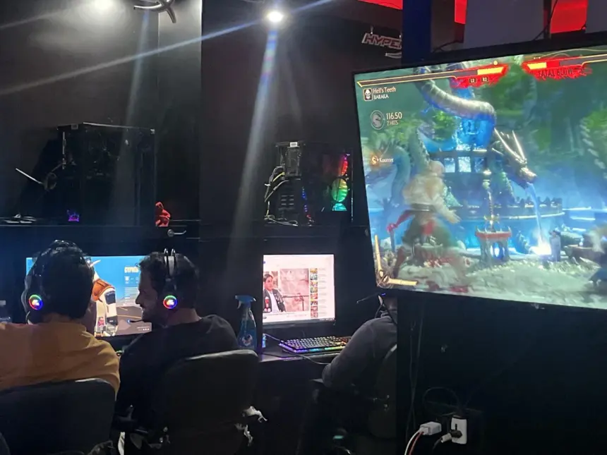Echo Esports Gaming Cafe Bangalore Review (2026): Both Locations Compared 11 Echo Esports Gaming Cafe Bangalore interior gamers playing Mortal Kombat with RGB headsets