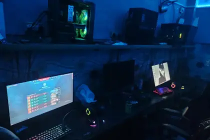 Squad Gaming Internet Cafe Delhi interior with gaming PCs and Valorant on screen