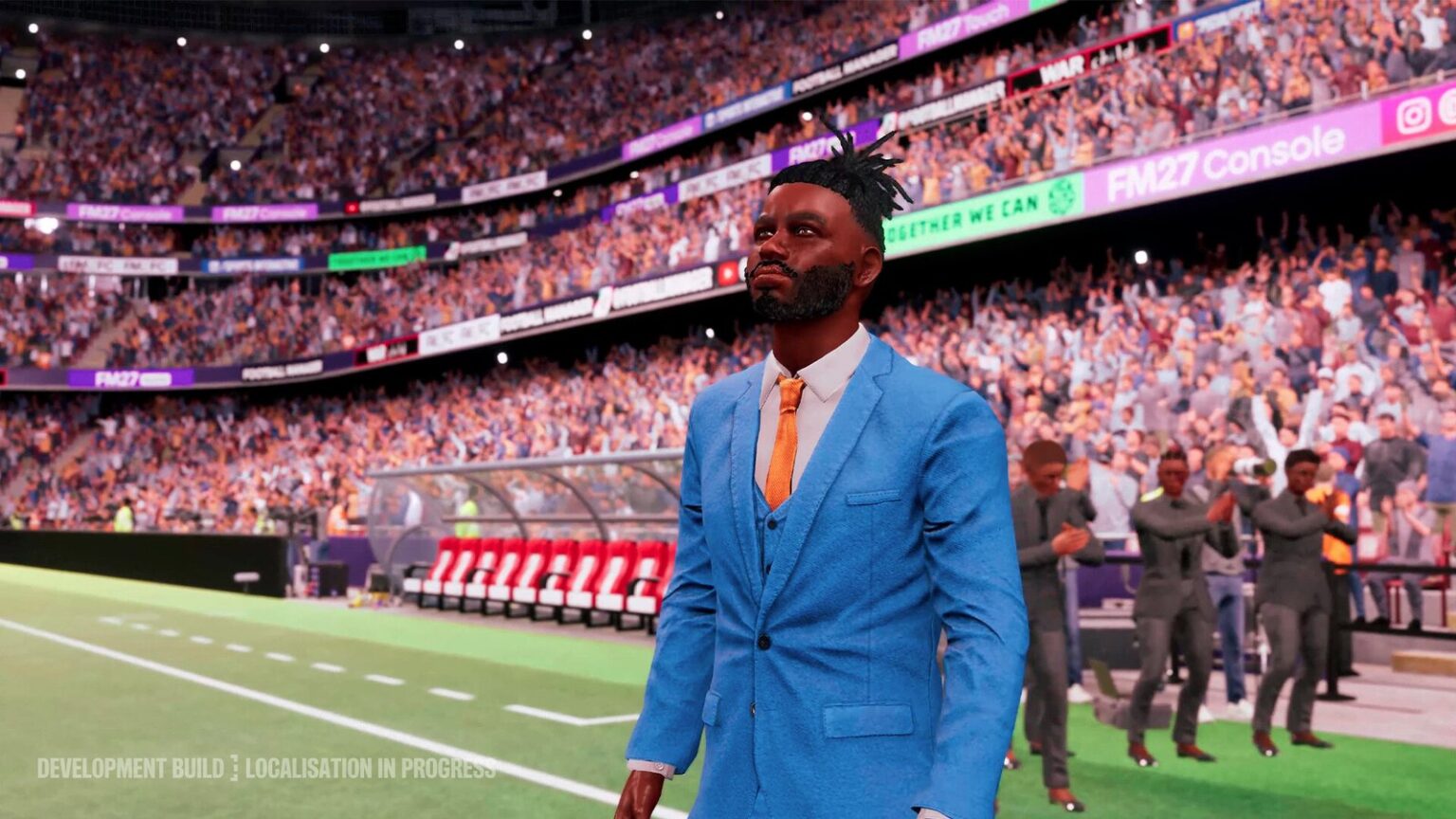 Football Manager 27 manager in a blue suit on the touchline of a packed stadium