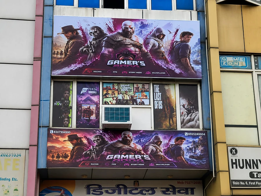 The front of the Gamer's Adda building with large game banners, Sector 7 Extension Road