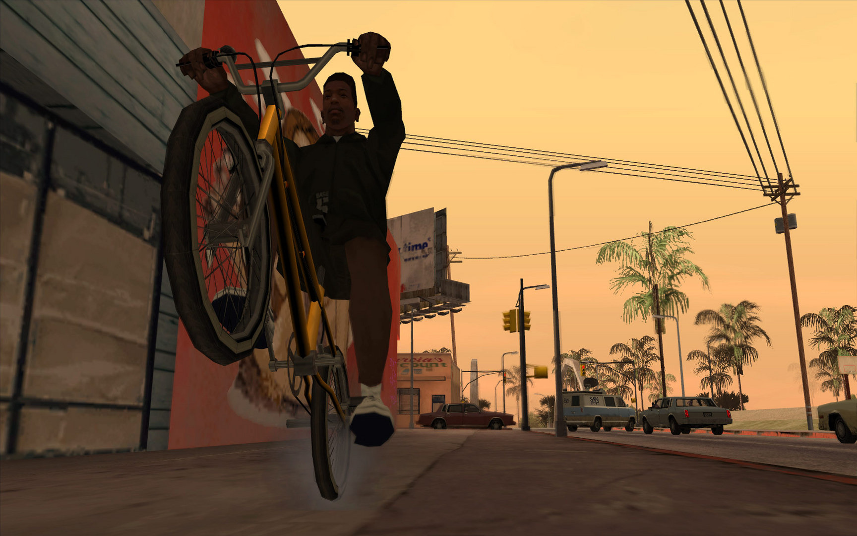 CJ popping a wheelie on a BMX on a sunlit Los Santos street