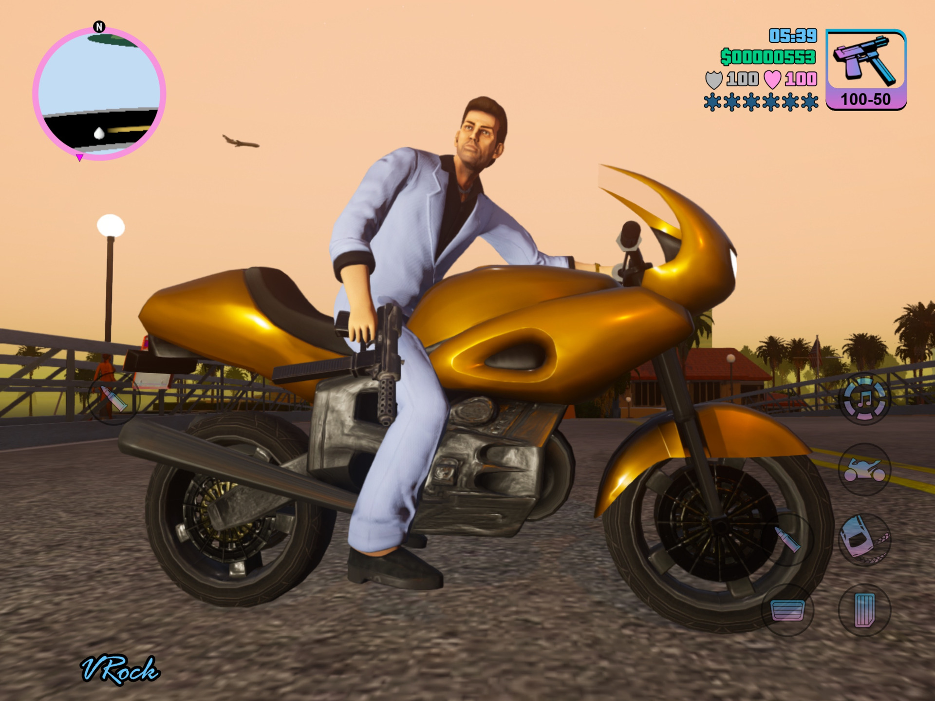 Tommy in a white suit on a gold motorbike, phone game controls on screen