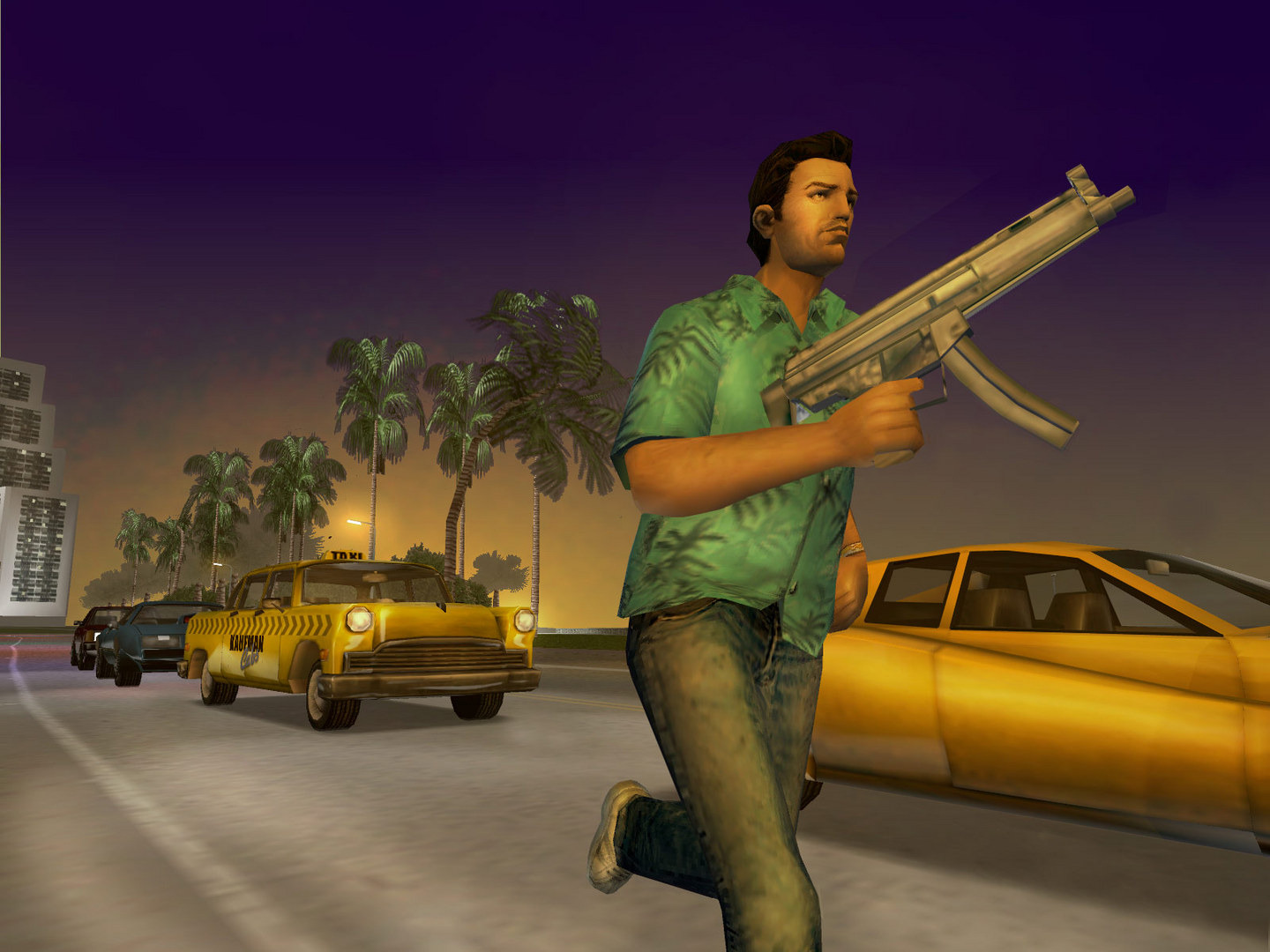 Tommy Vercetti with an SMG beside yellow taxis on a palm lined street at dusk