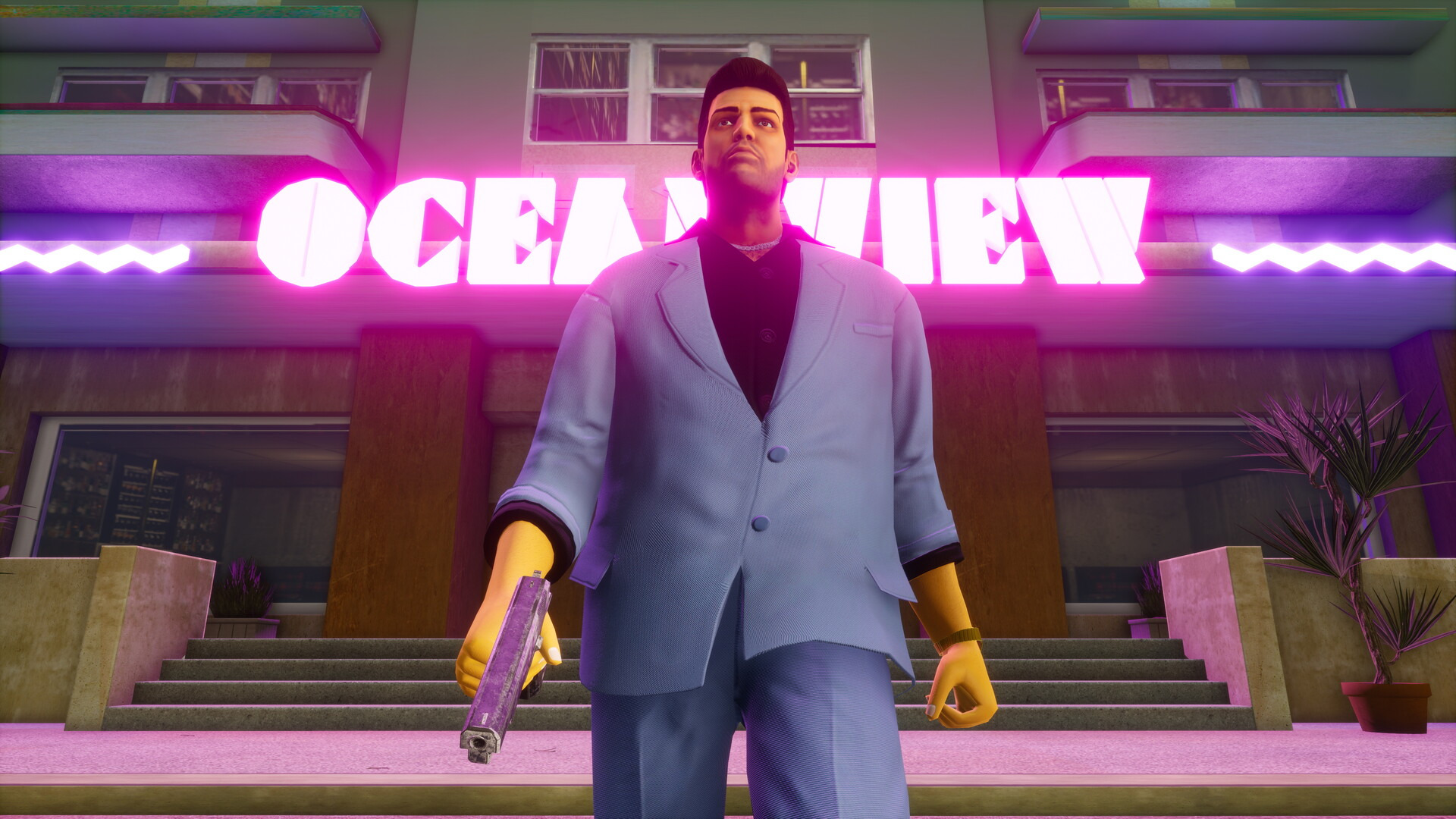 Tommy Vercetti in a pastel suit outside the neon Ocean View hotel